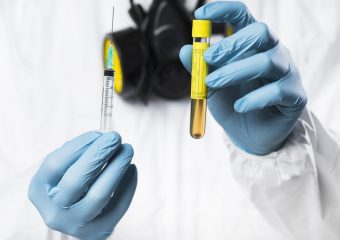 close-up-adult-male-holding-syringe-with-medical-treatment